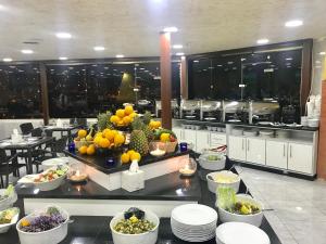 a restaurant with fruits and vegetables on a table at Petra Sella Hotel in Wadi Musa