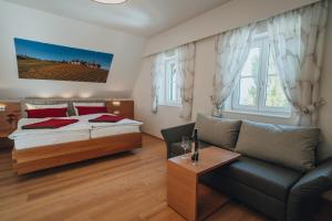 Łóżko lub łóżka w pokoju w obiekcie Weinquartier Pichler-Schober