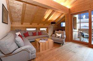 a living room with a couch and a table at Sonnenhof Appartements in Schröcken