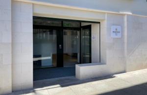 an entrance to a building with a glass door at Hotel Remigio in Tudela