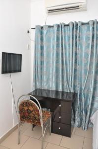 A television and/or entertainment centre at Haute Aparthotel