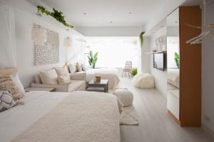 Postel nebo postele na pokoji v ubytování Urban Abode Apartment 1
