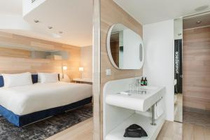 Postel nebo postele na pokoji v ubytování voco Milan-Fiere by IHG