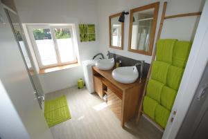 a bathroom with a sink and a mirror at Gîte "Le Sablon" à Unchair - Appartement de charme & prestations bien-être - A 20 mn de Reims centre in Unchair