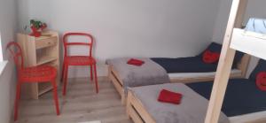 Postel nebo postele na pokoji v ubytování Kraków Chilli Hostel