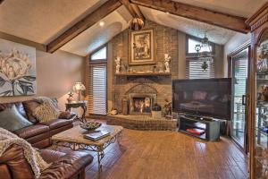 a living room with a couch and a fireplace at Family-Friendly Omaha Oasis about 10 Mi to Dtwn! in Omaha
