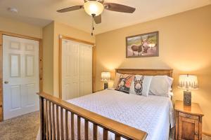 a bedroom with a bed and a ceiling fan at Pet-Friendly Big Bear Cabin about 6 Mi to Ski Resorts! in Sugarloaf