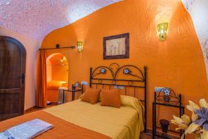 A bed or beds in a room at Cazorla Casas Cueva