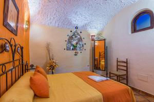 A bed or beds in a room at Cazorla Casas Cueva