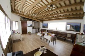 a dining room with a table and chairs in a room at B&B Il Baglio in Locogrande