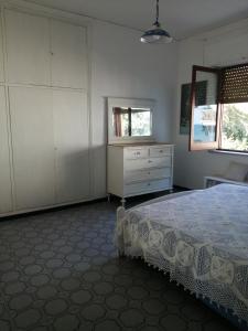 En eller flere senge i et værelse på VillaPietramaccarruna
