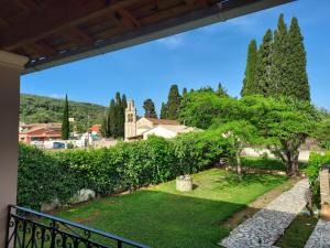 a view of a garden from the balcony of a house at Villa Marina in Liapades