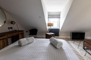 เตียงในห้องที่ Ty Belgrave - Apartment 4