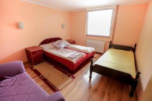 Ένα ή περισσότερα κρεβάτια σε δωμάτιο στο Vila Aris Zlatibor