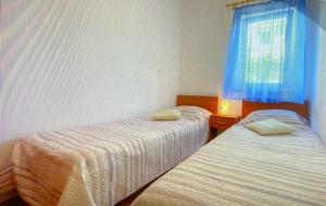 Ein Bett oder Betten in einem Zimmer der Unterkunft Apartman Hola
