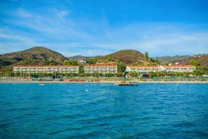 a resort on the shore of a body of water at Xenios Anastasia Resort & Spa in Nea Skioni