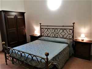 Postel nebo postele na pokoji v ubytování Vecchio Faro Residence