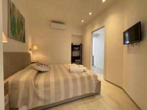 Giường trong phòng chung tại Casa Irene terrazza vista mare e garage