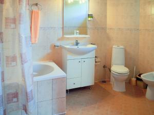 a bathroom with a sink and a toilet at Hotel Teres in Kazanlŭk
