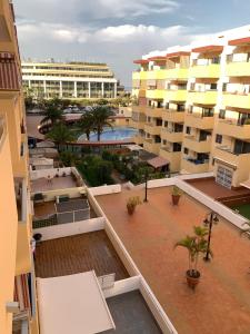 a view from the balcony of a apartment building at FANTASTIC APARTMENT. LOS CRISTIANOS. FREE WIFI. in Los Cristianos