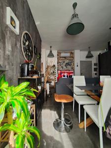 a restaurant with a table and chairs and plants at suite del borgo in Turin