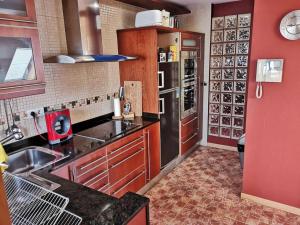 A kitchen or kitchenette at Ático Anllóns