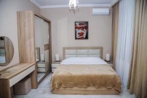 En eller flere senge i et værelse på Nice Apartments Tbilisi