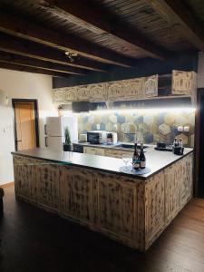 a kitchen with a wooden counter top in a room at Къща за гости "Боеви" in Yakovtsi