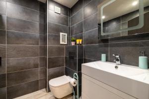 A bathroom at Apartment City Home Még 31 kép