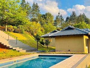 a house with a swimming pool in a yard at Langalanga on the mountain bend in Tzaneen