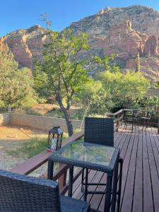 a table and chairs on a deck with a mountain at Sedona Room Homestay - Thunder Mountain in Sedona