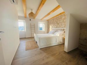 Postel nebo postele na pokoji v ubytování Villa Piscitelli