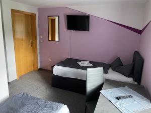 Posteľ alebo postele v izbe v ubytovaní Pension & Gaststätte Bauernstube