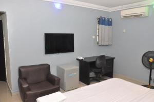 A television and/or entertainment centre at Haute Aparthotel