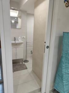 a bathroom with a shower and a sink at IL GECO in Naples +42 photos