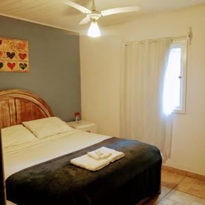 Cama ou camas em um quarto em Pousada Casa Azul