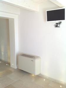 TV a/nebo společenská místnost v ubytování Cantaluna B&B