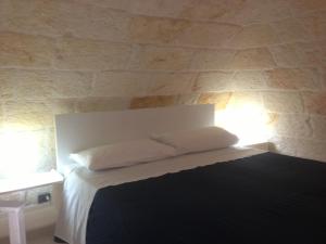 Postel nebo postele na pokoji v ubytování Cantaluna B&B