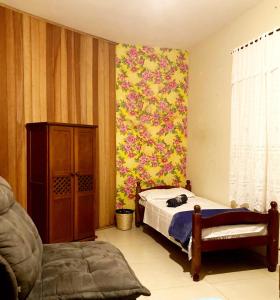 מיטה או מיטות בחדר ב-Hostel Morada do sol Paraty