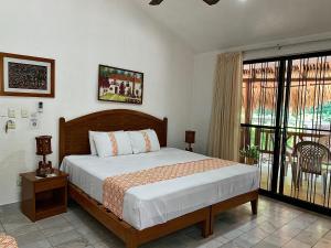 Giường trong phòng chung tại Villas Mercedes +27 ảnh