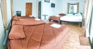 Lova arba lovos apgyvendinimo įstaigoje Noppakhun Resort