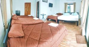 Postel nebo postele na pokoji v ubytování Noppakhun Resort