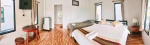 Postel nebo postele na pokoji v ubytování Noppakhun Resort