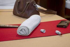 a roll of toilet paper on a table with a purse at Davao Hub Bed and Breakfast in Davao City