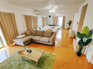 a living room with a couch and a table at River Sky Hakata in Fukuoka