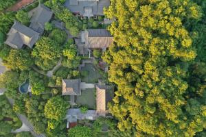 an overhead view of a house in the midst of trees at Guilin Yi Characteristic Hotel CoLTD in Guilin