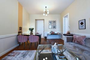 a living room with a couch and a table at 6 rooms Naschmarkt in Vienna