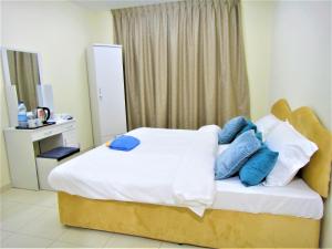 Abu Hail Star Residence - Home Stay客房内的一张或多张床位