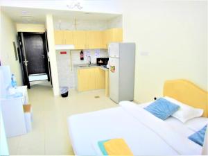 Kuchyň nebo kuchyňský kout v ubytování Abu Hail Star Residence - Home Stay