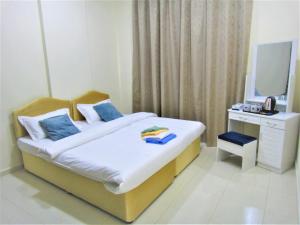 Abu Hail Star Residence - Home Stay客房内的一张或多张床位